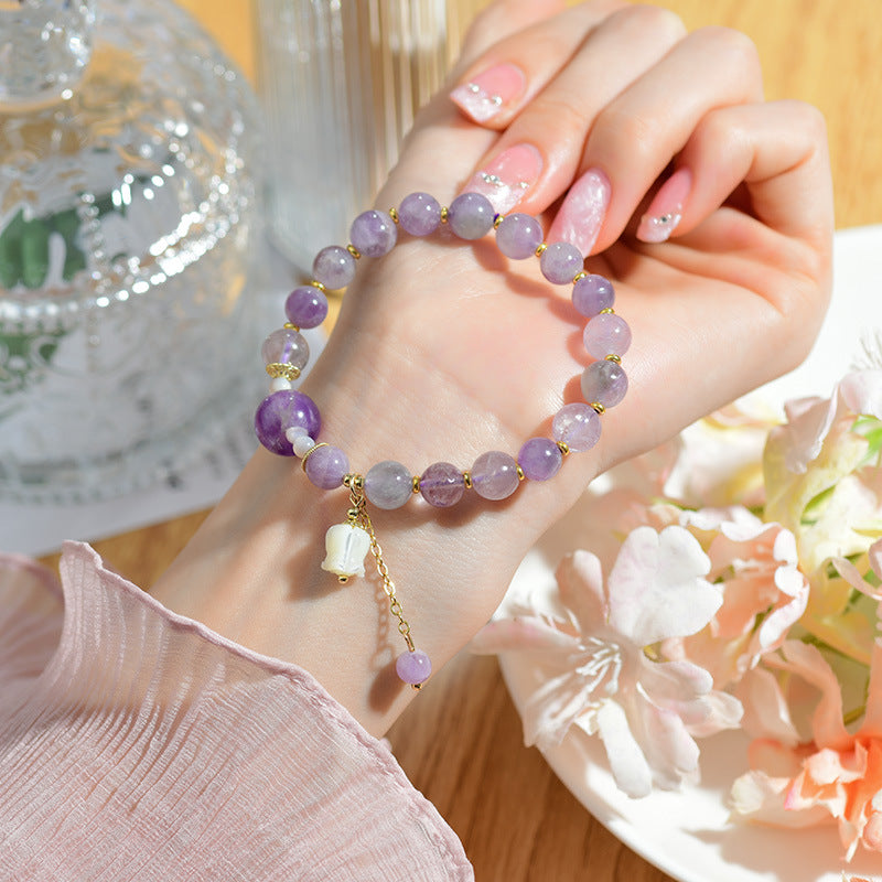 Pulsera de amatista natural con colgante de concha y lirio de los valles