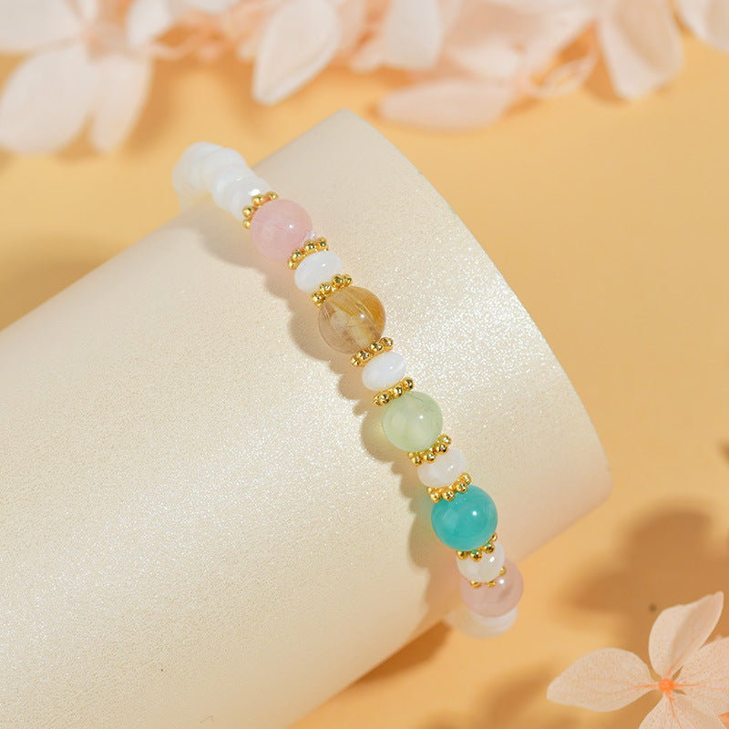 Pulsera hecha a mano de conchas, perlas y cristales