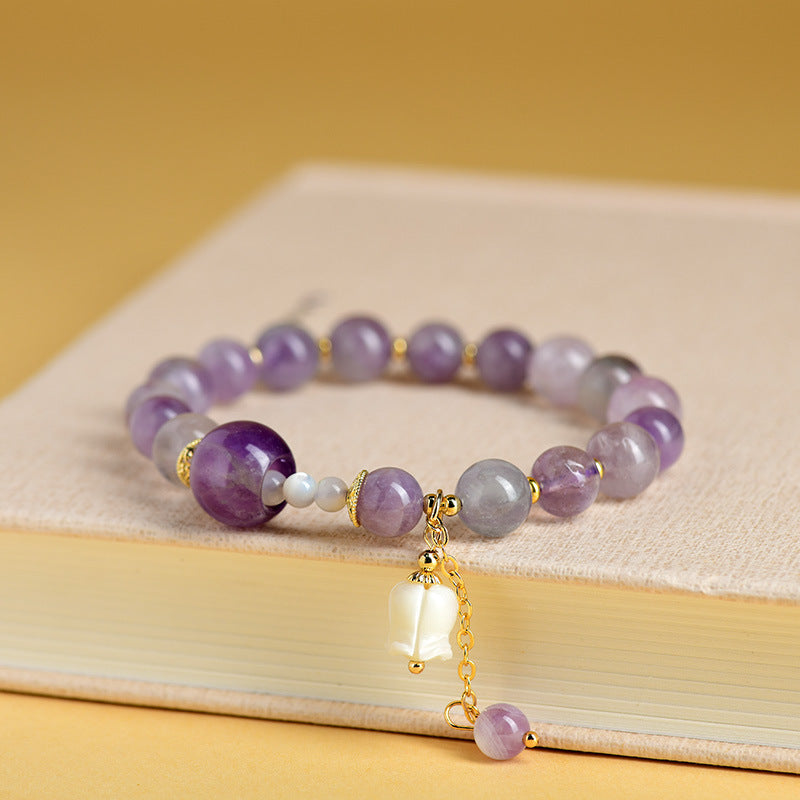 Pulsera de amatista natural con colgante de concha y lirio de los valles