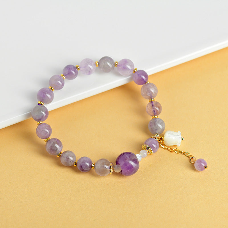 Pulsera de amatista natural con colgante de concha y lirio de los valles
