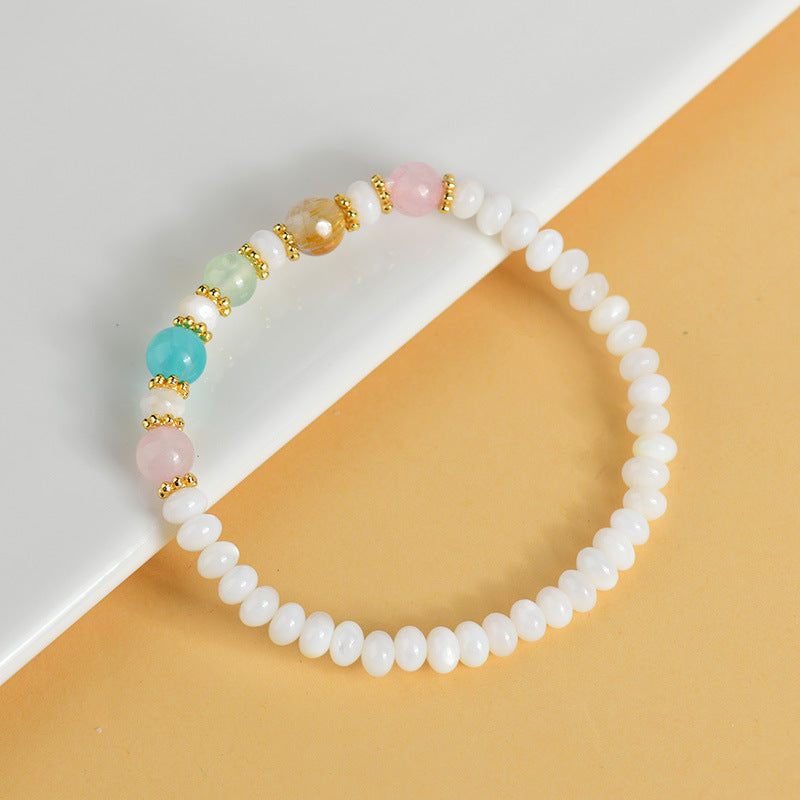 Pulsera hecha a mano de conchas, perlas y cristales