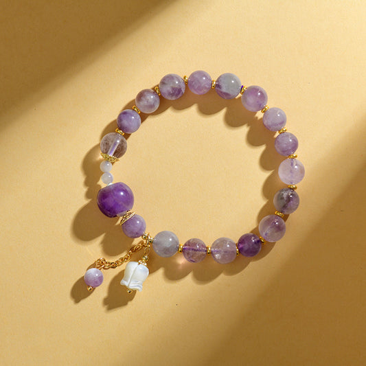 Pulsera de amatista natural con colgante de concha y lirio de los valles