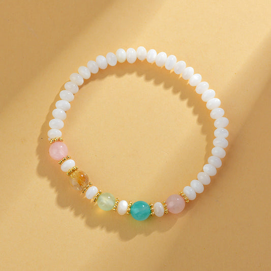 Pulsera hecha a mano de conchas, perlas y cristales