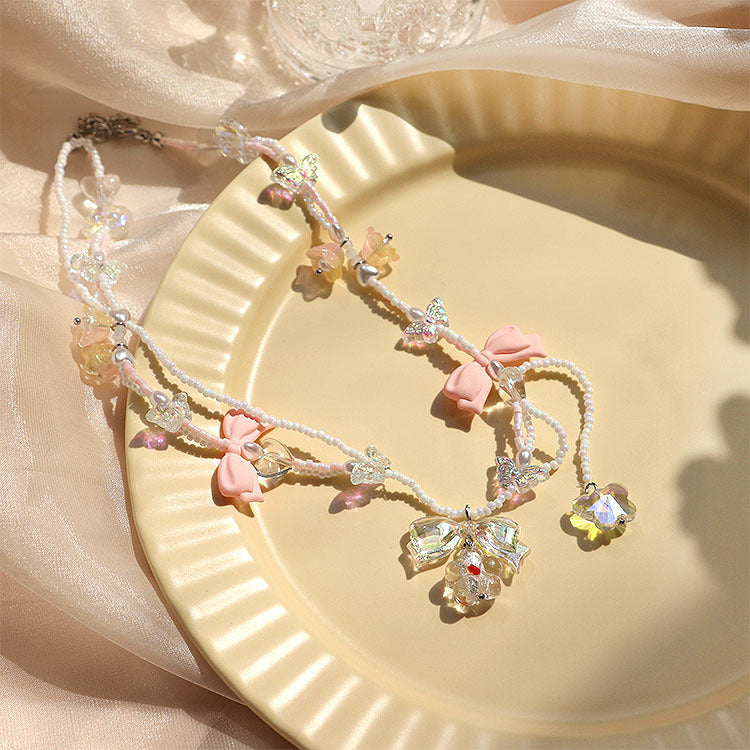Collar hecho a mano con cuentas de cristal y perlas brillantes con lazo de mariposa