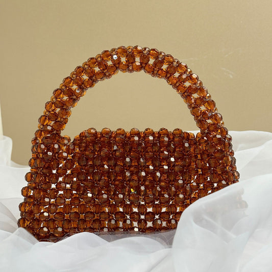 Bolso de mano de moda con cuentas hechas a mano en color marrón
