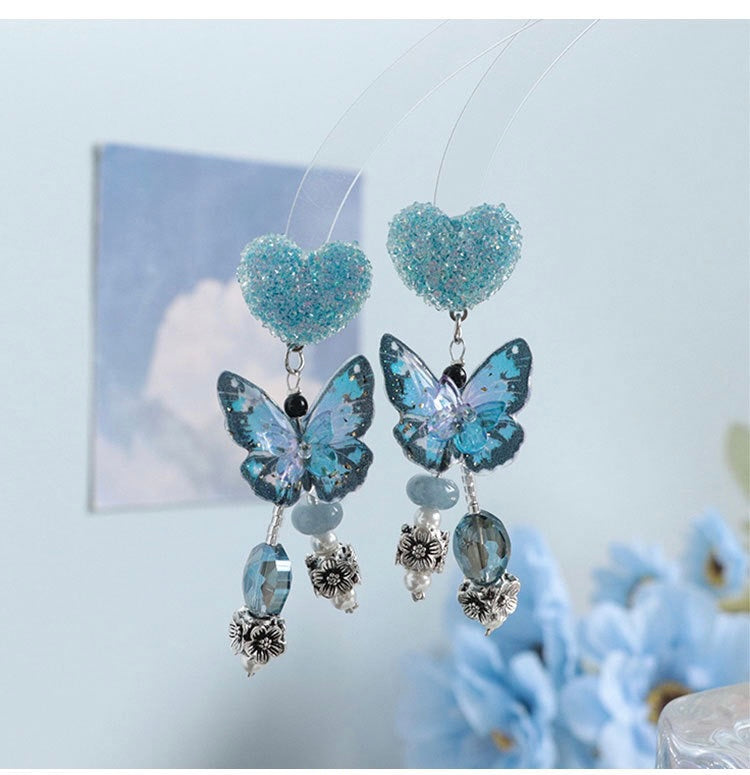 Pendientes de plata de ley con cuentas de mariposa azul