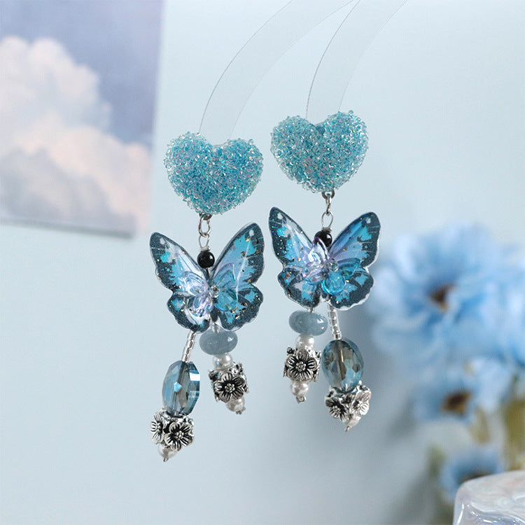 Pendientes de plata de ley con cuentas de mariposa azul