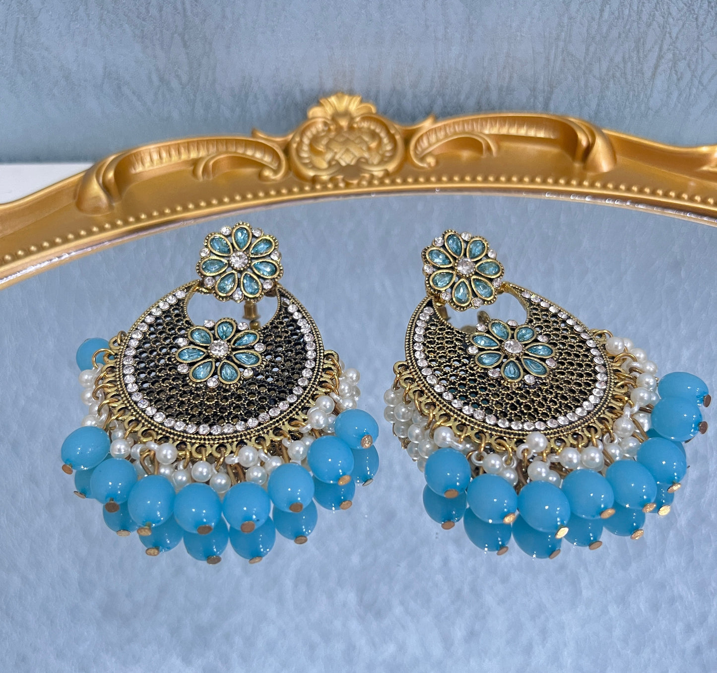 With a purchase of $100 or more at our store, you can receive a pair of Bohemian-style zirconia rhinestone vintage earrings.